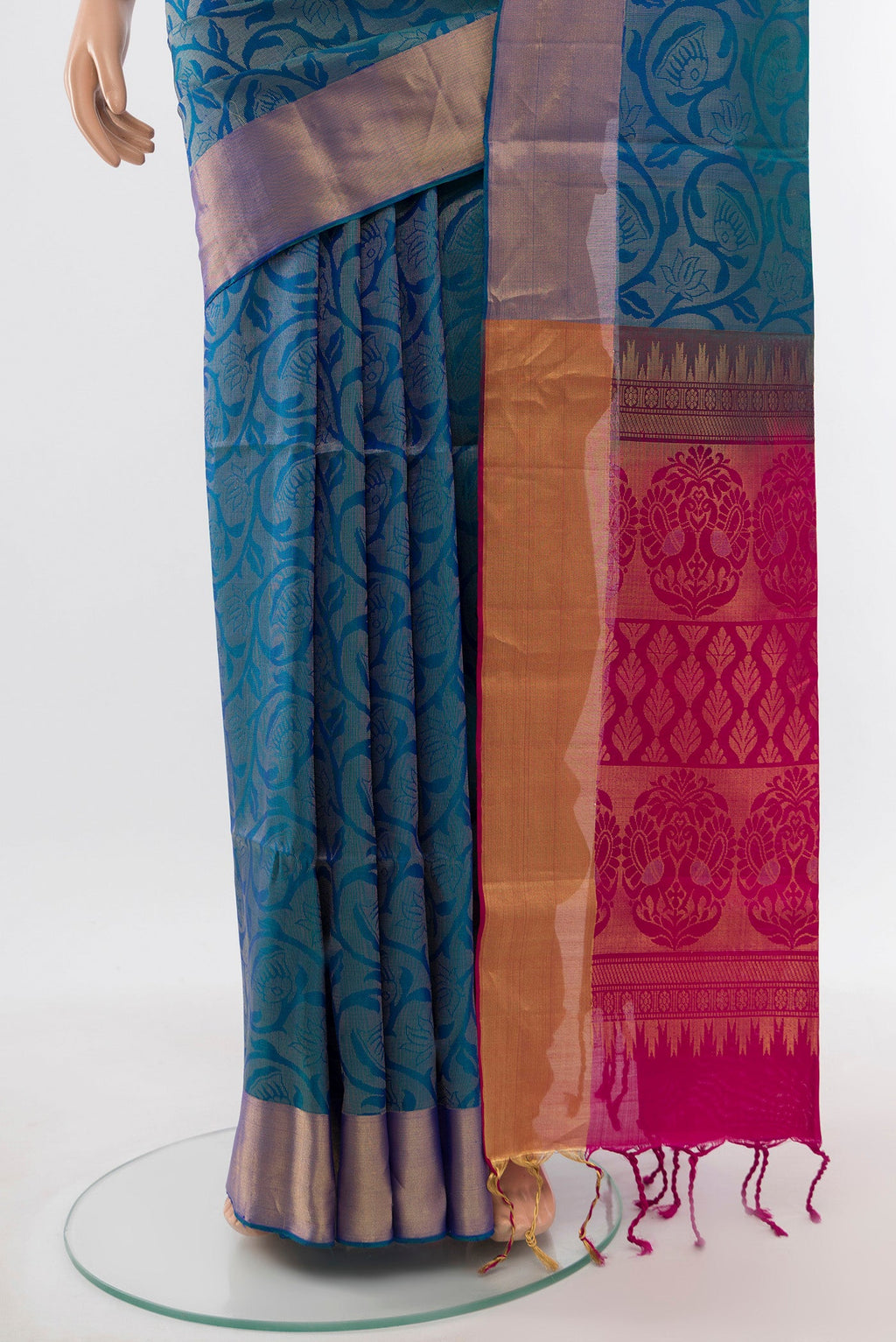 Pleats and pallu of Peacock Blue Soft Silk Saree with Zari Butta on the body and Silk Border. 