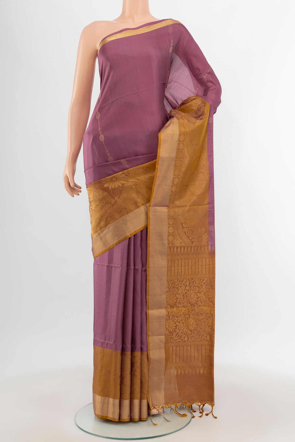 Mauve Soft Silk Saree with Zari Butta on the body and Zari Border.  displayed on a mannequin