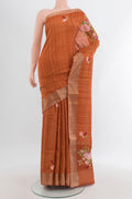 Rust Blended Art Silk Saree with Embroidery on the body and Zari Border.  displayed on a mannequin