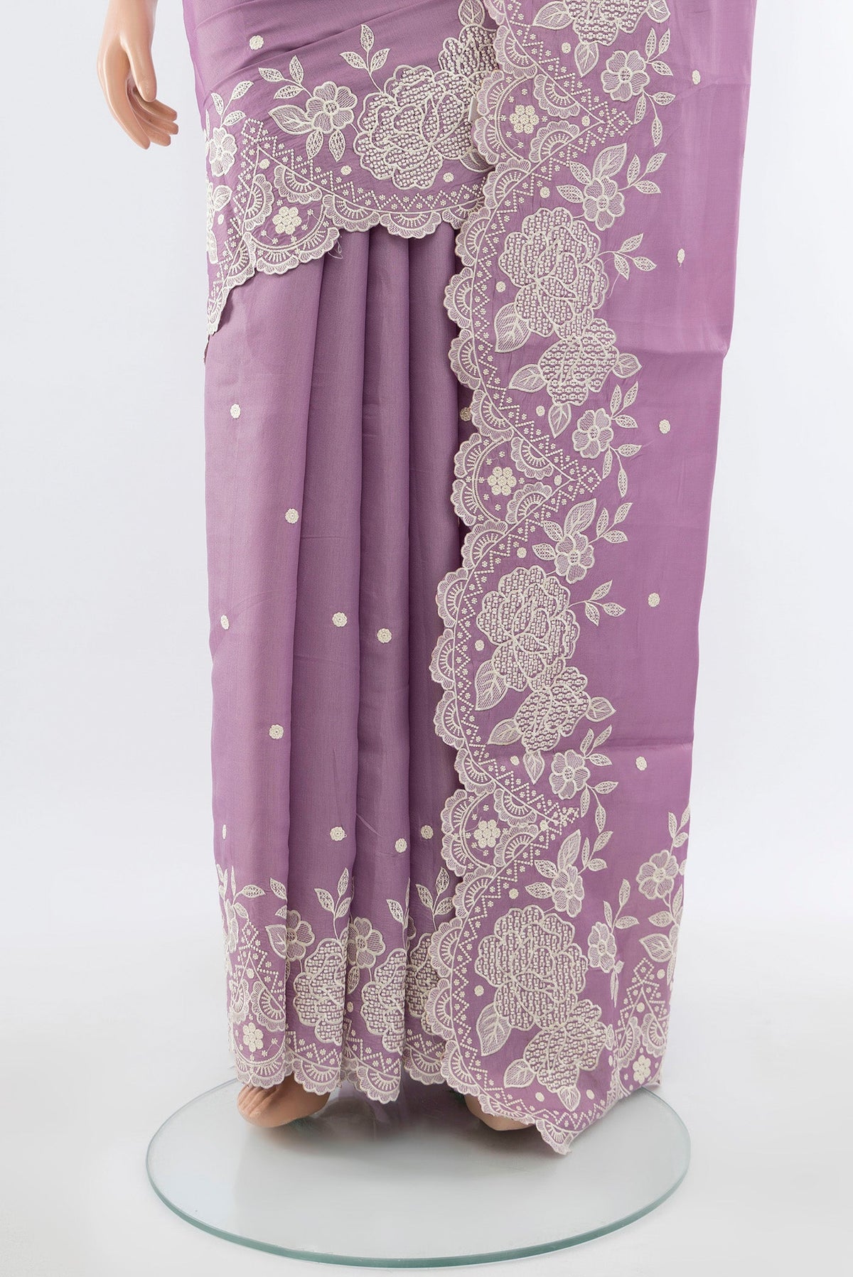 Pleats and pallu of Lavender Art Silk Saree with Embroidery on the body and Silk Border. 