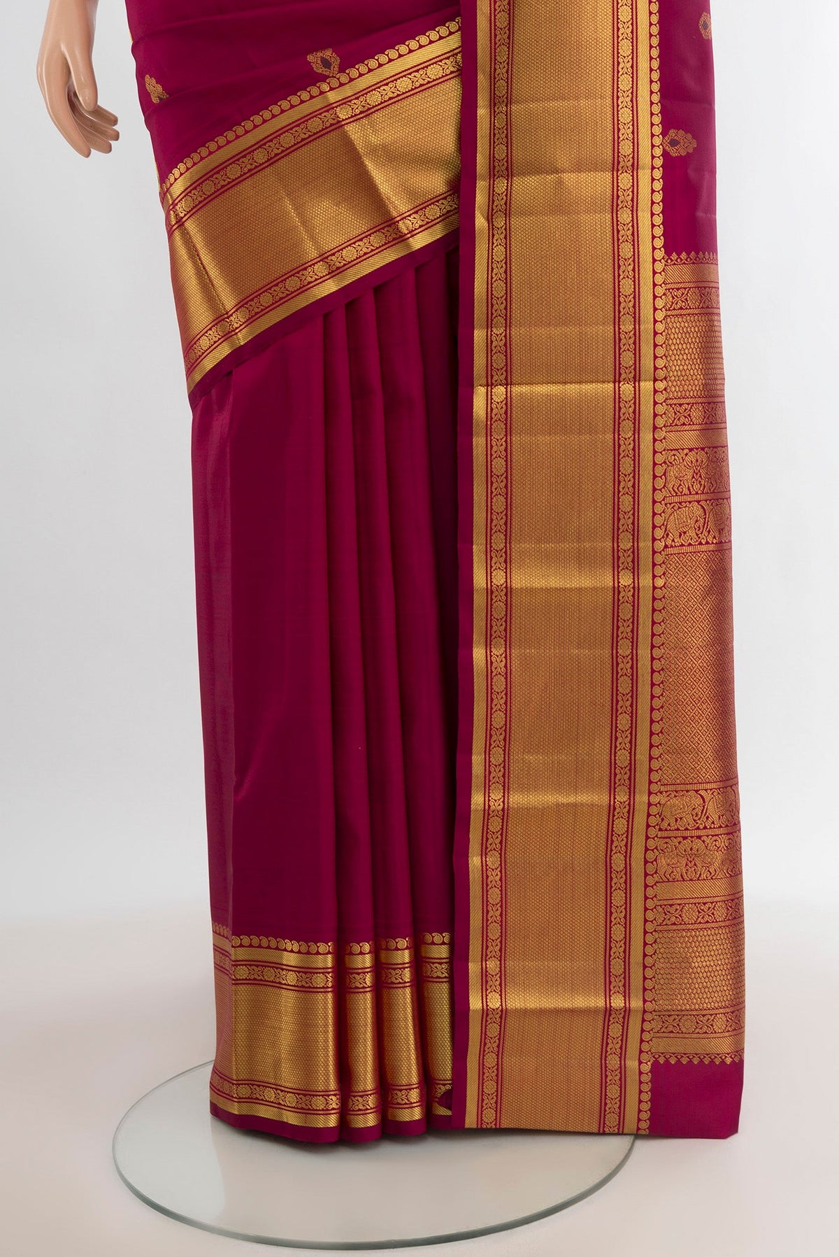 Pleats and pallu of Maroon Kanjivaram Silk Saree with Zari Butta on the body and Zari Border. 
