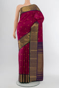 Purple Kanjivaram Silk Saree with Zari Butta on the body and Silk Border.  displayed on a mannequin