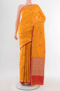 Yellow Banarasi Katan Silk Saree with Zari Butta on the body and Silk Border.  displayed on a mannequin