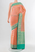 Rose Gold Soft Silk Saree with Zari Butta on the body and Silk Border.  displayed on a mannequin