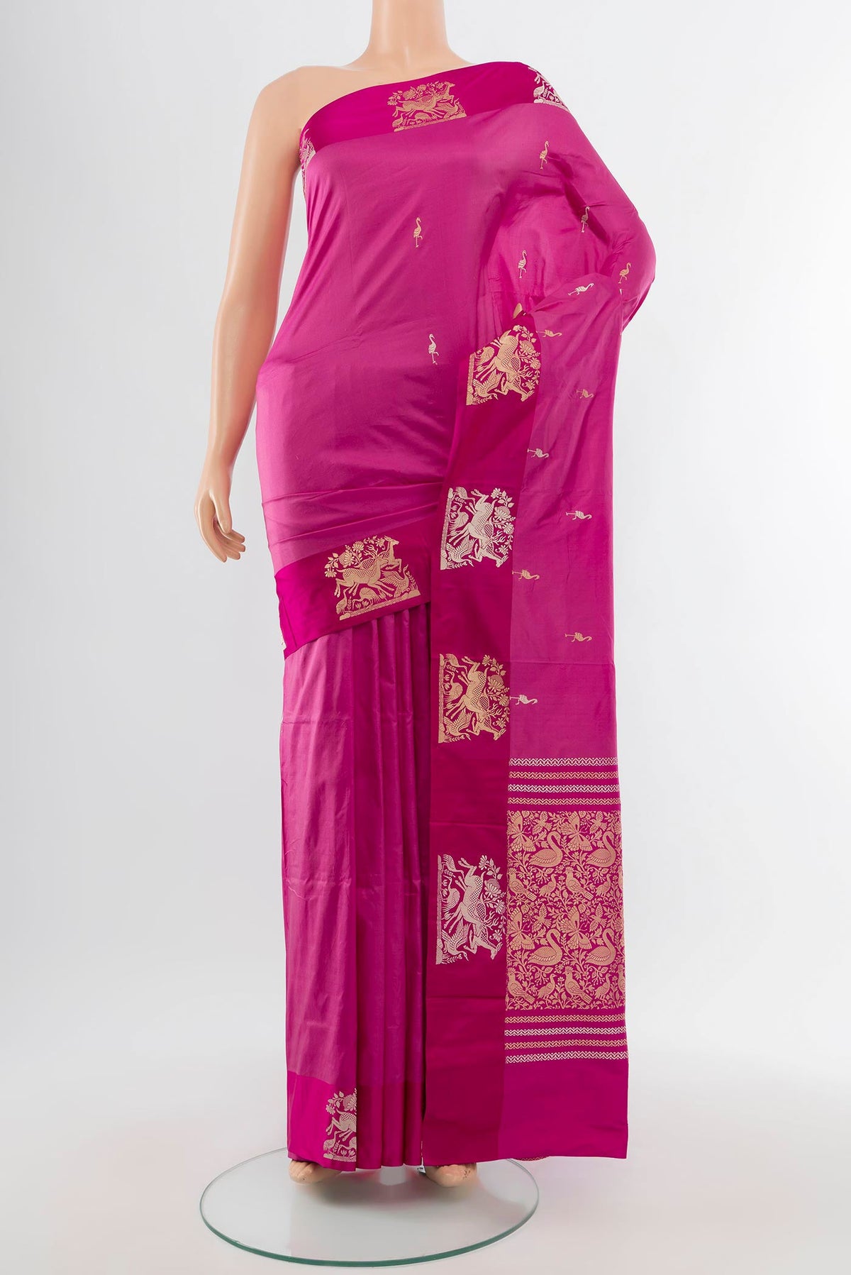 Bronze Banarasi Katan Silk Saree with Zari Butta on the body and Silk Border.  displayed on a mannequin
