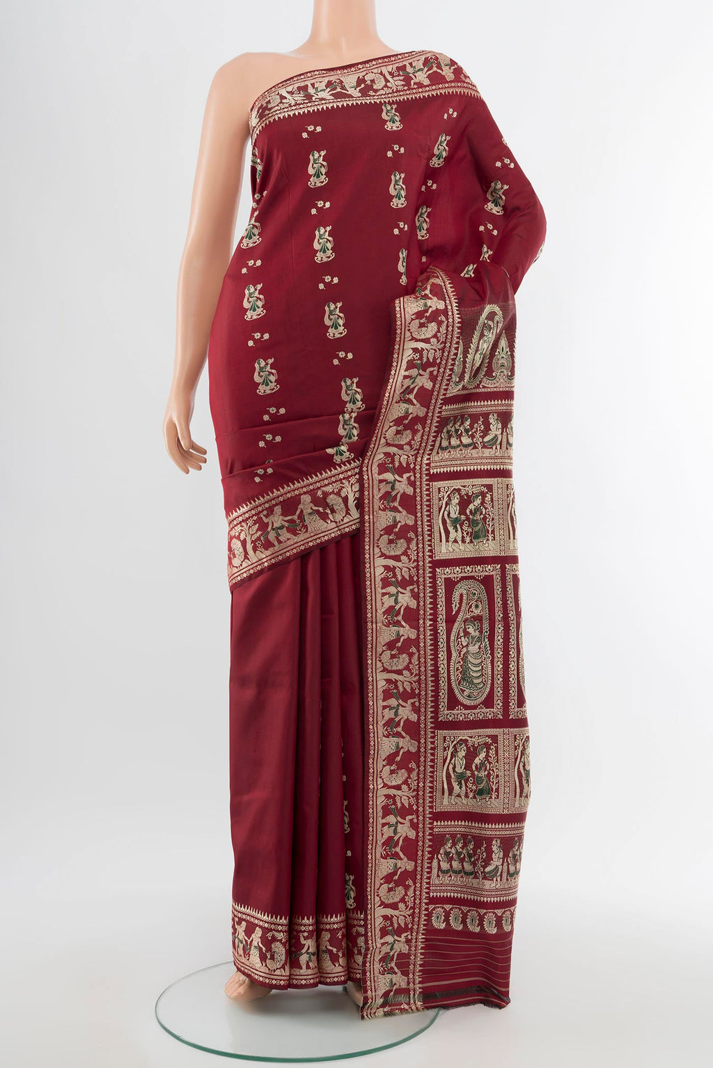Maroon Baluchari Silk Saree with Zari Butta on the body and Silk Border.  displayed on a mannequin