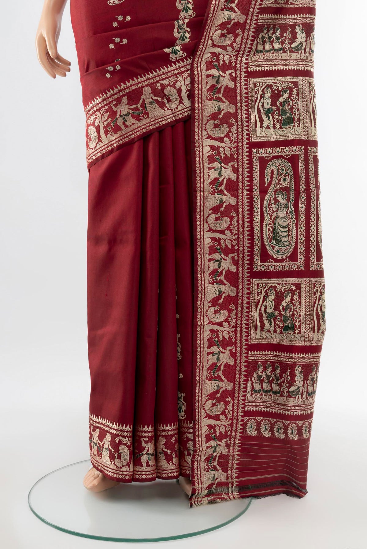 Pleats and pallu of Maroon Baluchari Silk Saree with Zari Butta on the body and Silk Border. 
