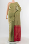 Sage Green Soft Silk Saree with Zari Butta on the body and Without Border.  displayed on a mannequin