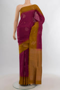 Maroon Soft Silk Saree with Zari Butta on the body and Plain Border.  displayed on a mannequin