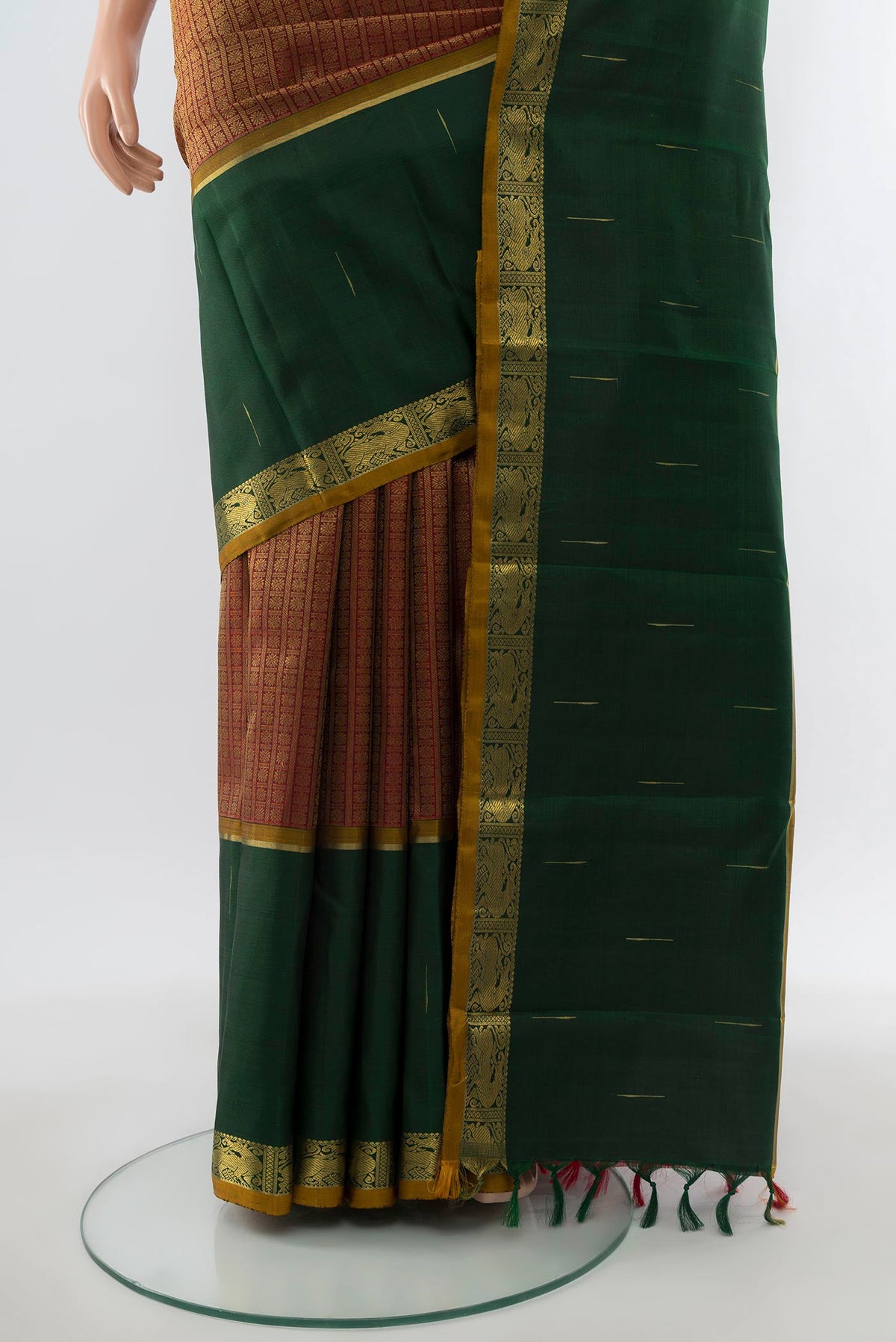 Pleats and pallu of Pure Silk Pure Zari Maroon Kanjivaram Saree with Zari Brocade on the body and Zari Border. 