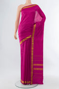 Dark Pink Kanjivaram Silk Saree with Plain Body and Silk Border.  displayed on a mannequin