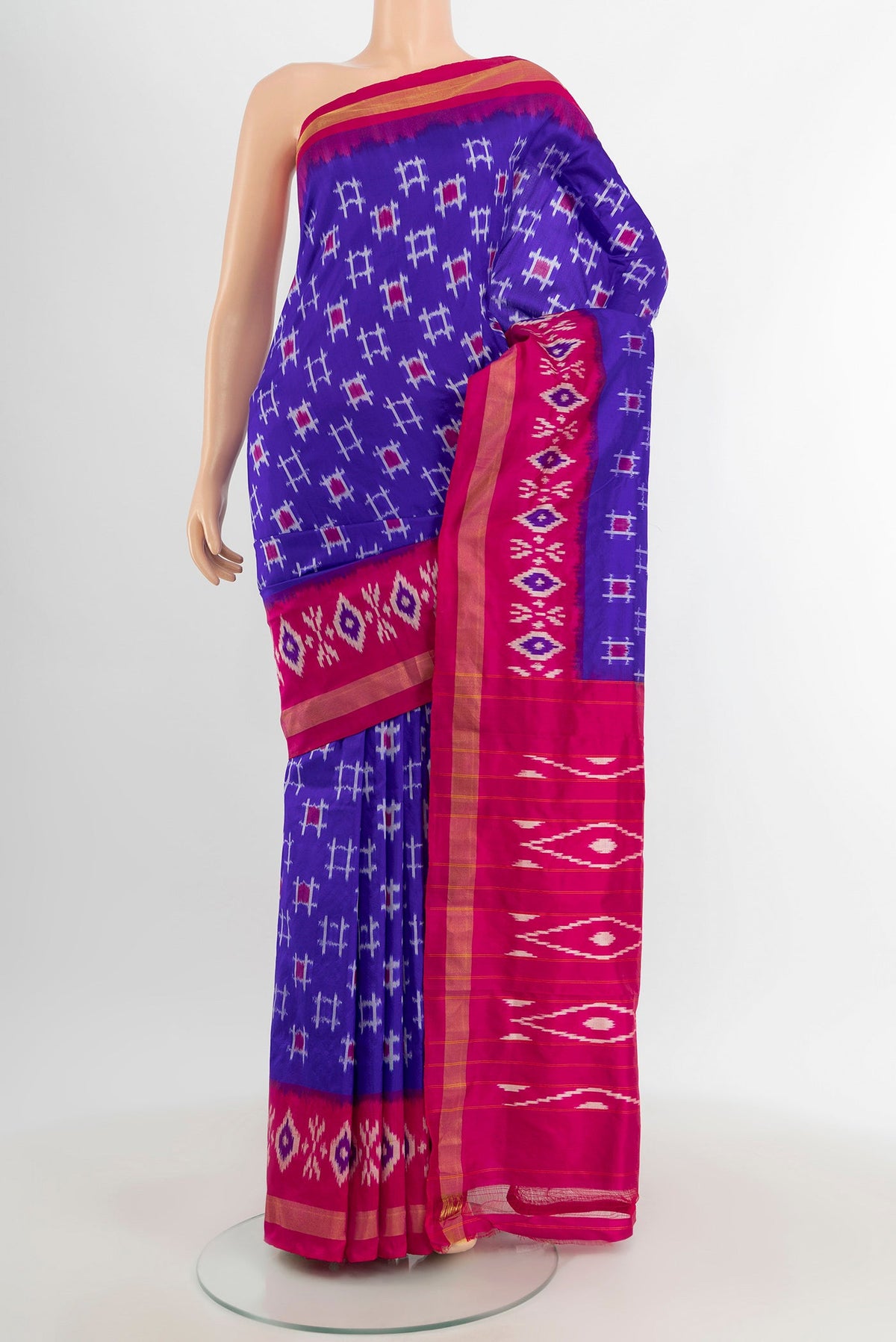 Blue Pochampally Silk Saree with Ikat design on the body and Ikat Border.  displayed on a mannequin