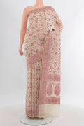 Cream Banarasi Silk Saree with Thread Butta on the body and Thread Border.  displayed on a mannequin
