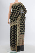 Black Banarasi Silk Saree with Zari Butta on the body and Zari Border.  displayed on a mannequin
