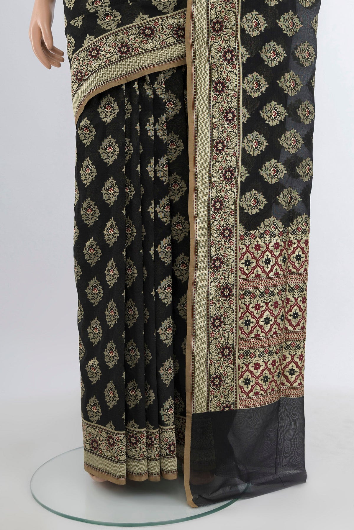 Pleats and pallu of Black Banarasi Silk Saree with Zari Butta on the body and Zari Border. 