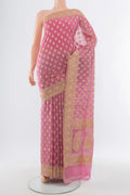 Rose Gold Banarasi Silk Saree with Zari Butta on the body and Silk Border.  displayed on a mannequin