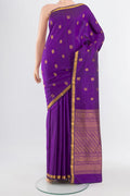 Violet Kanjivaram Silk Saree with Zari Butta on the body and Silk Border.  displayed on a mannequin