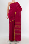 Maroon Kanchipuram Silk Saree with Plain Body and Zari Border.  displayed on a mannequin