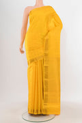 Yellow Kanchipuram Silk Saree with Zari Butta on the body and Zari Border.  displayed on a mannequin
