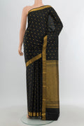 Black Kanchipuram Silk Saree with Zari Butta on the body and Zari Border.  displayed on a mannequin