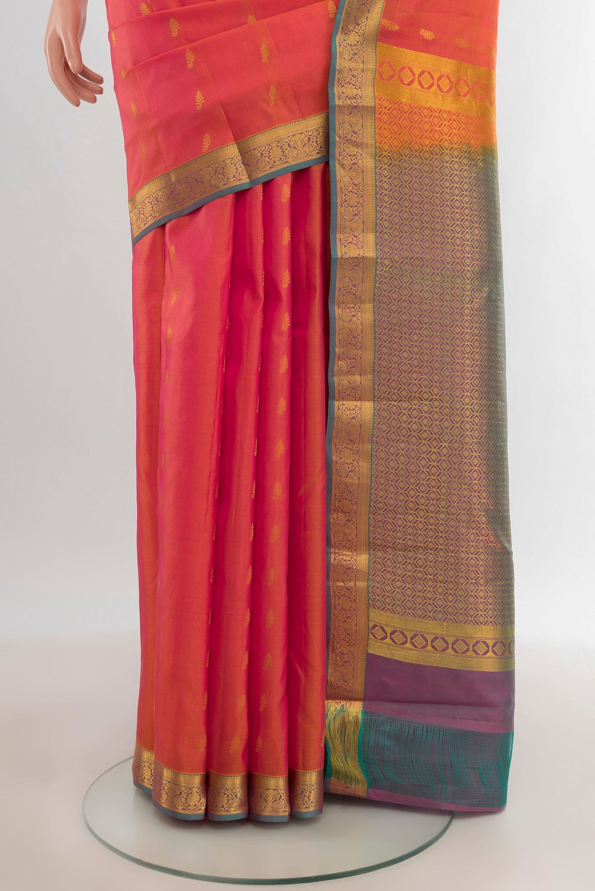 Pleats and pallu of Golden Peach Kanjivaram Silk Saree with Zari Butta on the body and Zari Border. 