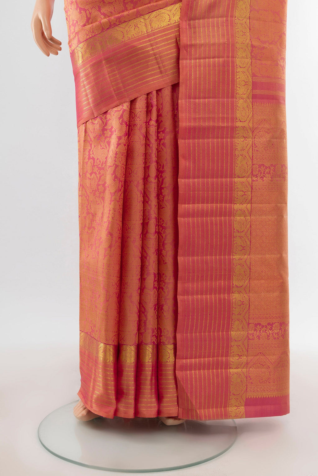 Pleats and pallu of Golden Peach Dual Tone Kanchipuram Silk Saree with Zari Brocade on the body and Zari Border. 