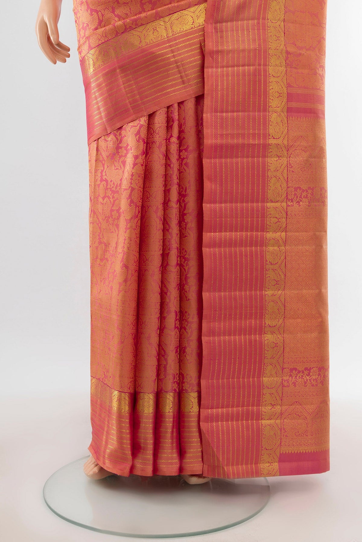 Pleats and pallu of Golden Peach Dual Tone Kanchipuram Silk Saree with Zari Brocade on the body and Zari Border. 