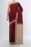 Maroon Kanjivaram Silk Saree with Plain Body and Thread Border.  displayed on a mannequin