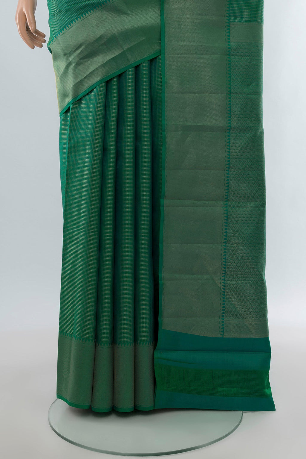 Pleats and pallu of Green Kanchipuram Silk Saree with Checked design on the body and Zari Border. 