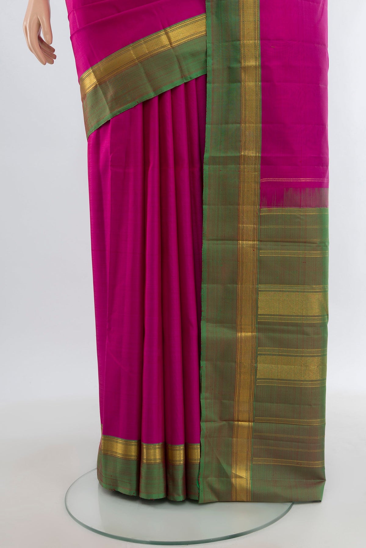 Pleats and pallu of Rani Pink Kanjivaram Silk Saree with Plain Body and Zari Border. 