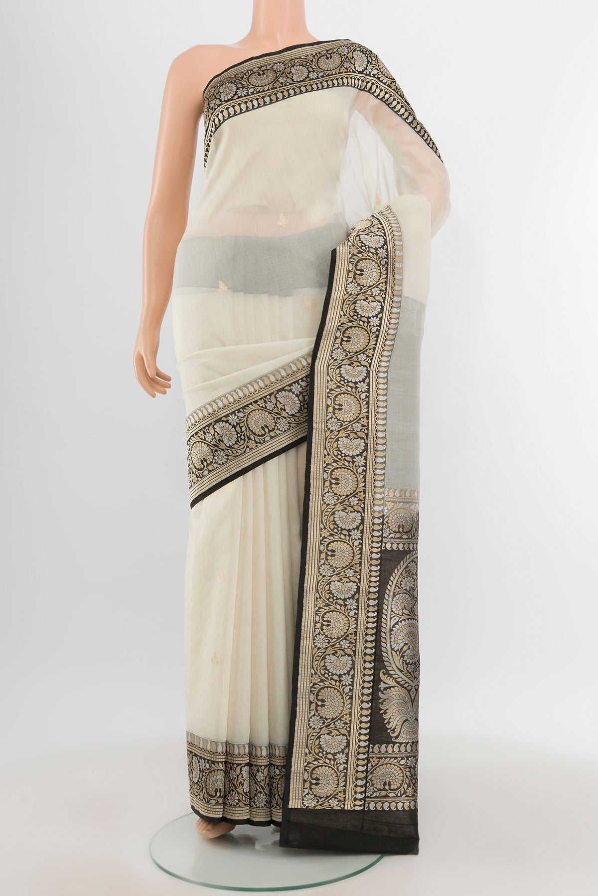 White Banarasi Kora Silk Saree with Zari Butta on the body and Zari Border.  displayed on a mannequin