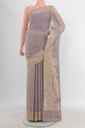Lilac Banarasi Kora Silk Saree with Zari Butta on the body and Zari Border.  displayed on a mannequin
