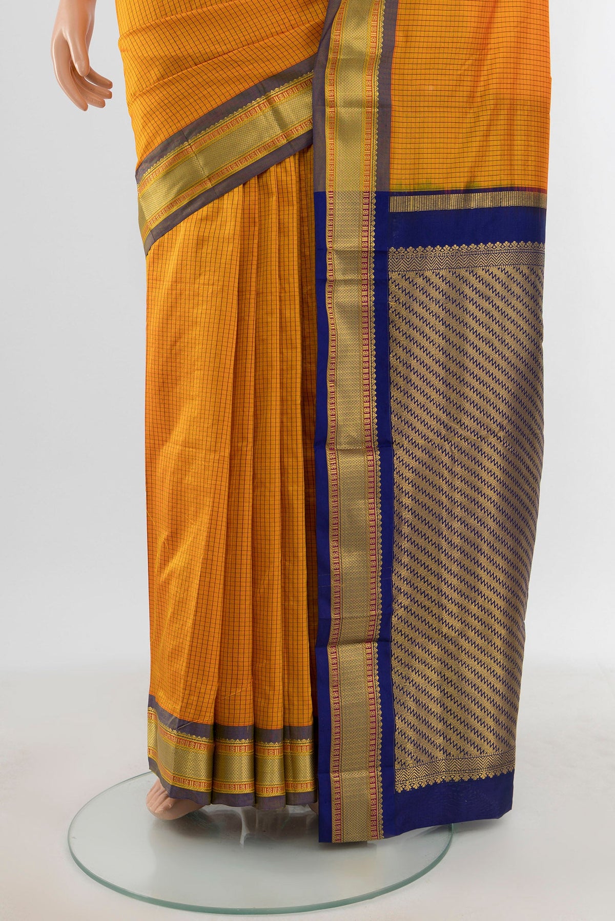 Pleats and pallu of Yellow Narayanpet Silk Saree with Checked design on the body and Zari Border. 