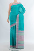 Sky Blue Kanchipuram Silk Saree with Plain Body and Thread Border.  displayed on a mannequin