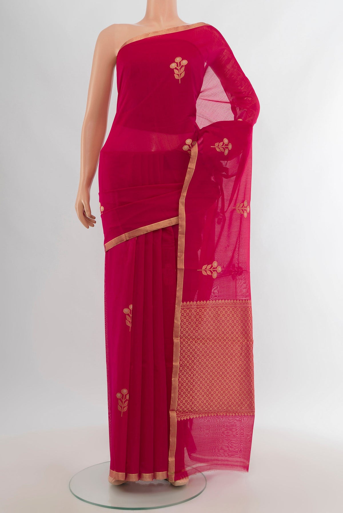 Dark Pink Banarasi Kora Cotton Saree with Zari Butta on the body and Zari Border.  displayed on a mannequin