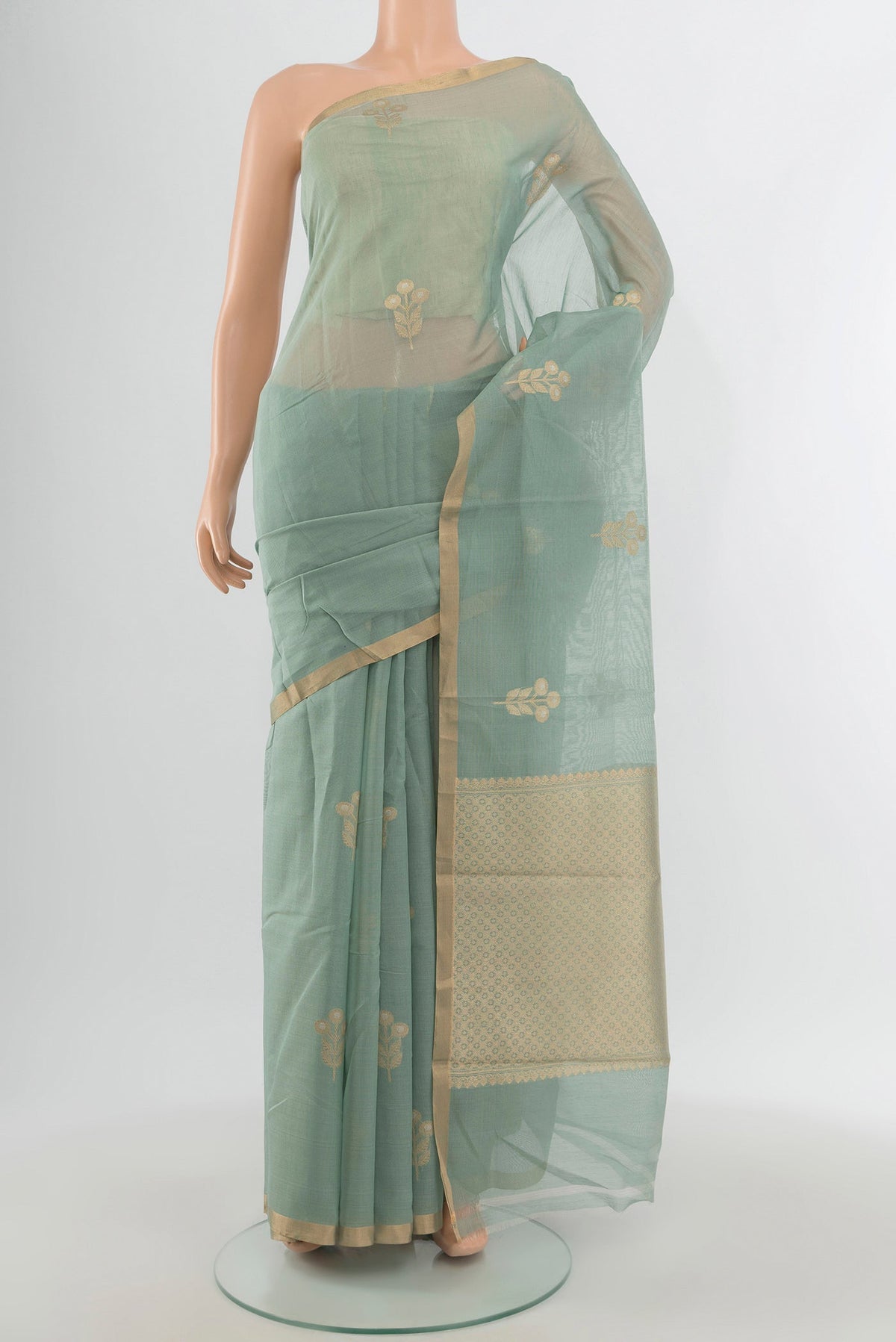 Grey Banarasi Kora Cotton Saree with Zari Butta on the body and Zari Border.  displayed on a mannequin