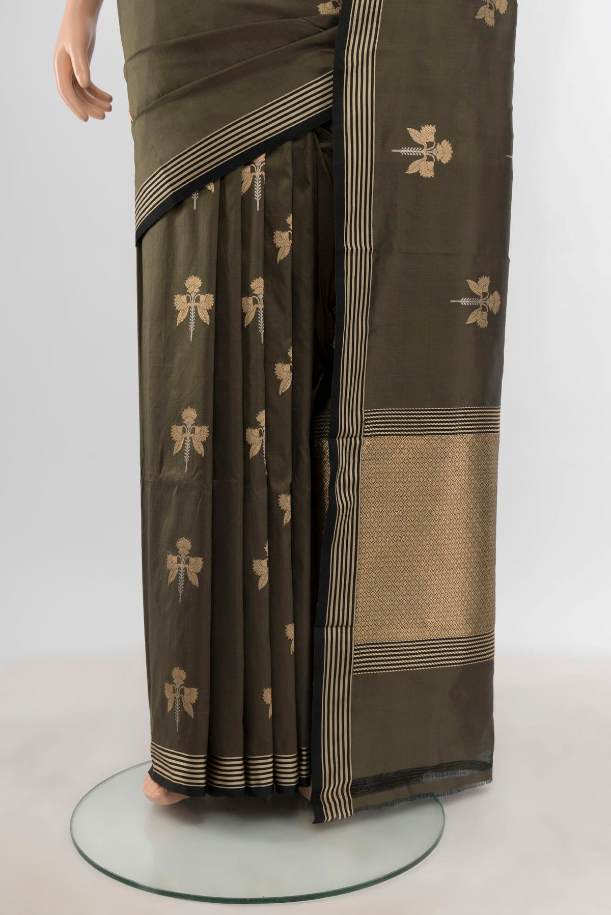 Pleats and pallu of Olive Green Banarasi Katan Silk Saree with Zari Butta on the body and Thin Zari Line. 