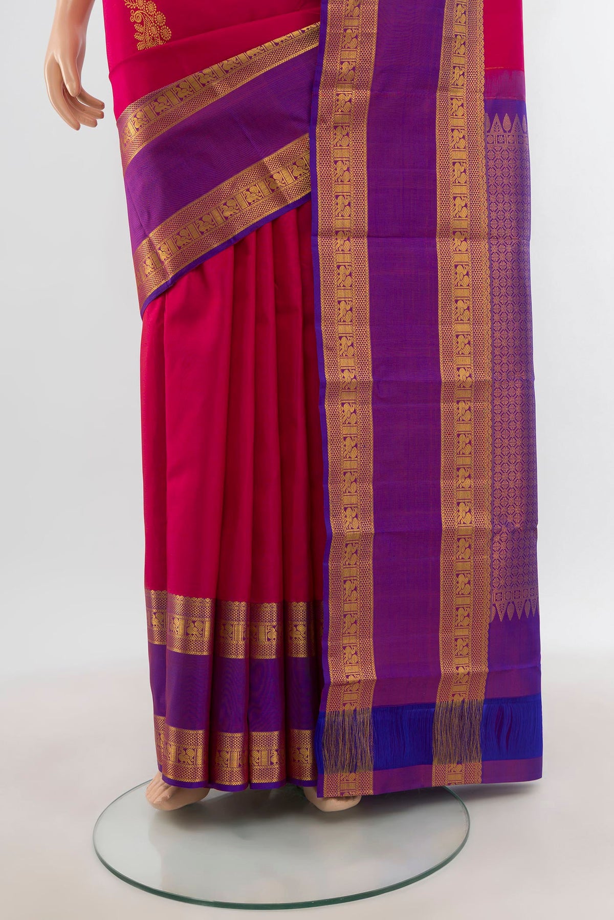 Pleats and pallu of Dark Pink Kanchipuram Silk Saree with Zari Butta on the body and Zari Border. 