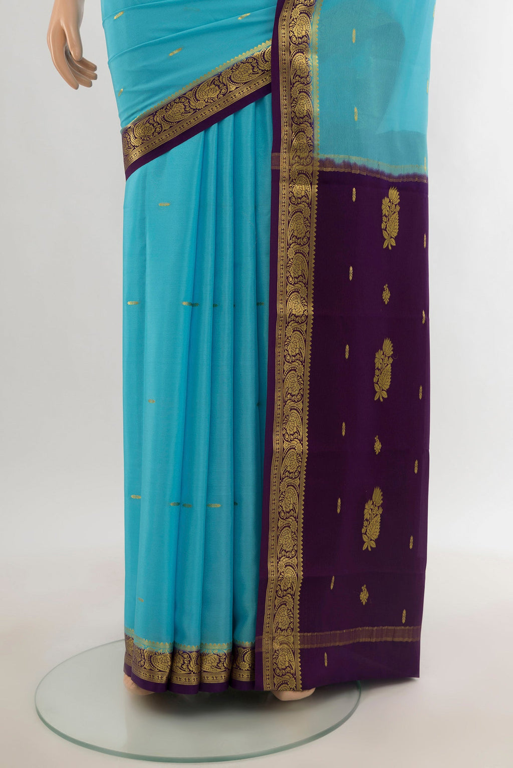 Pleats and pallu of Sky Blue Mysore Crepe Saree with Zari Butta on the body and Silk Border. 