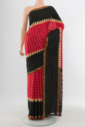 Red Pochampally Silk Saree with Ikat design on the body and Ikat Border.  displayed on a mannequin