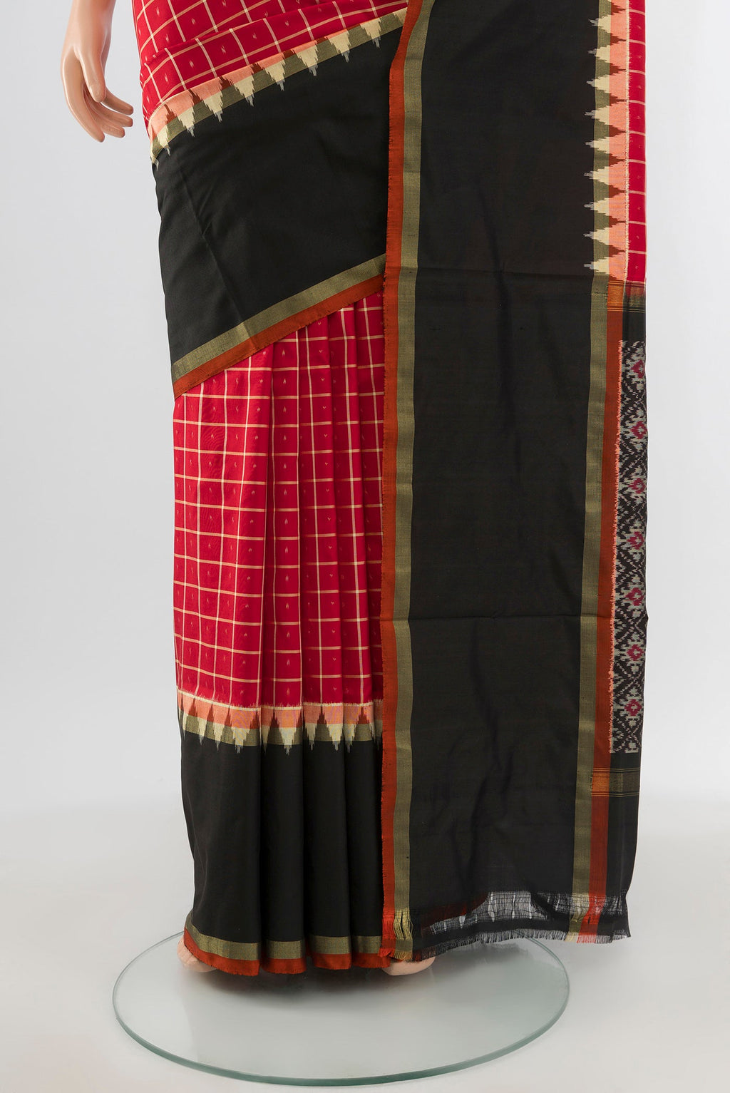 Pleats and pallu of Red Pochampally Silk Saree with Ikat design on the body and Ikat Border. 