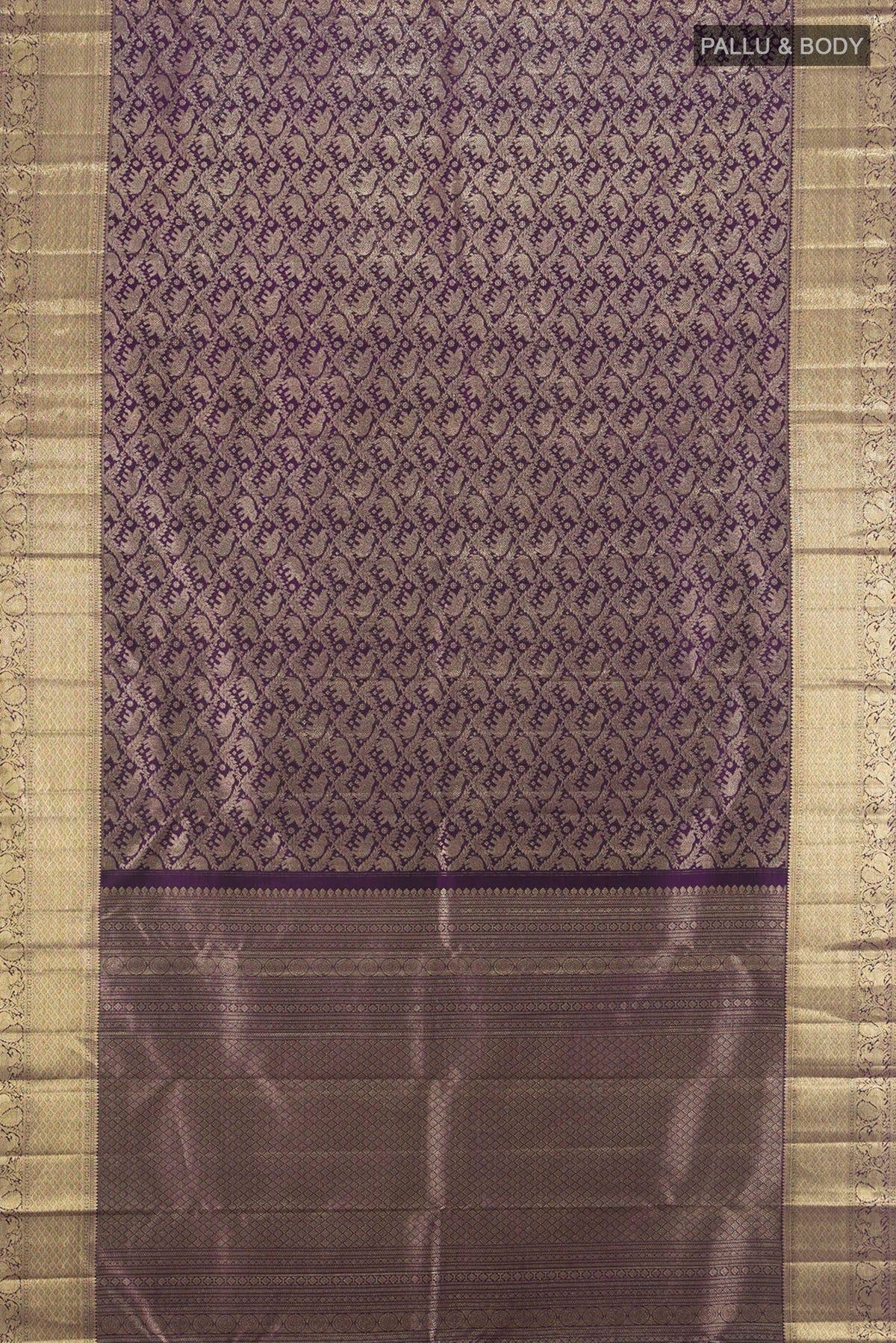Flat view of Violet Kanchipuram Silk Saree with Zari Brocade on the body and Zari Border. 