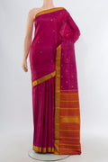 Dark Pink Kanchipuram Silk Saree with Zari Butta on the body and Zari Border.  displayed on a mannequin