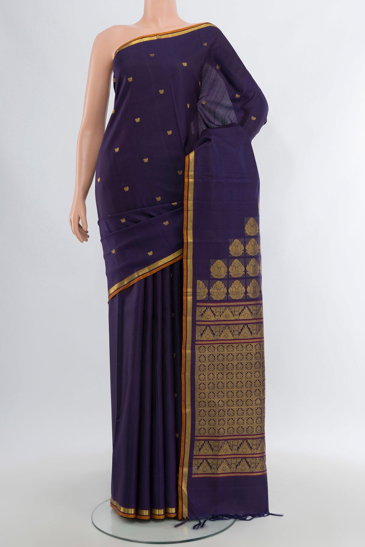 Pure Silk Pure Zari Navy Blue Kanjivaram Saree with Zari Butta on the body and Zari Border.  displayed on a mannequin