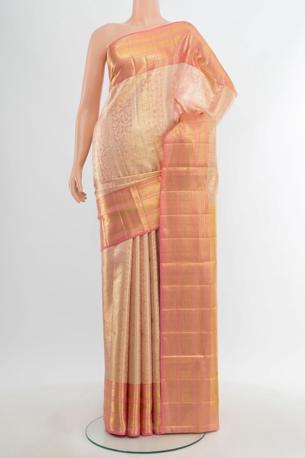 Golden Kanjivaram Tissue Silk Saree with Zari Brocade on the body and Zari Border.  displayed on a mannequin