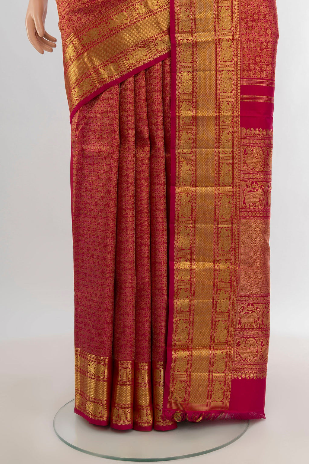 Pleats and pallu of Pure Silk Pure Zari Dark Pink Kanjivaram Saree with Zari Brocade on the body and Zari Border. 