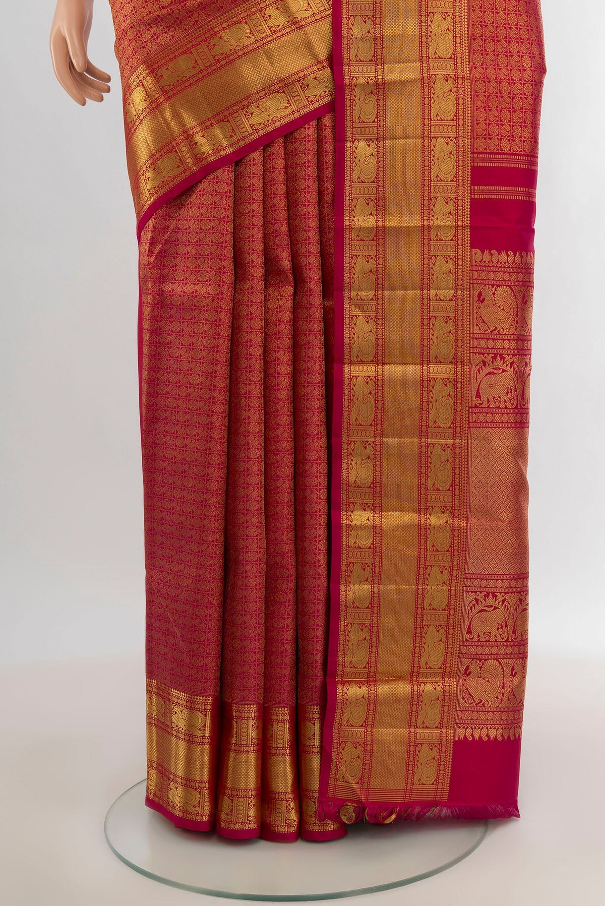 Pleats and pallu of Pure Silk Pure Zari Dark Pink Kanjivaram Saree with Zari Brocade on the body and Zari Border. 