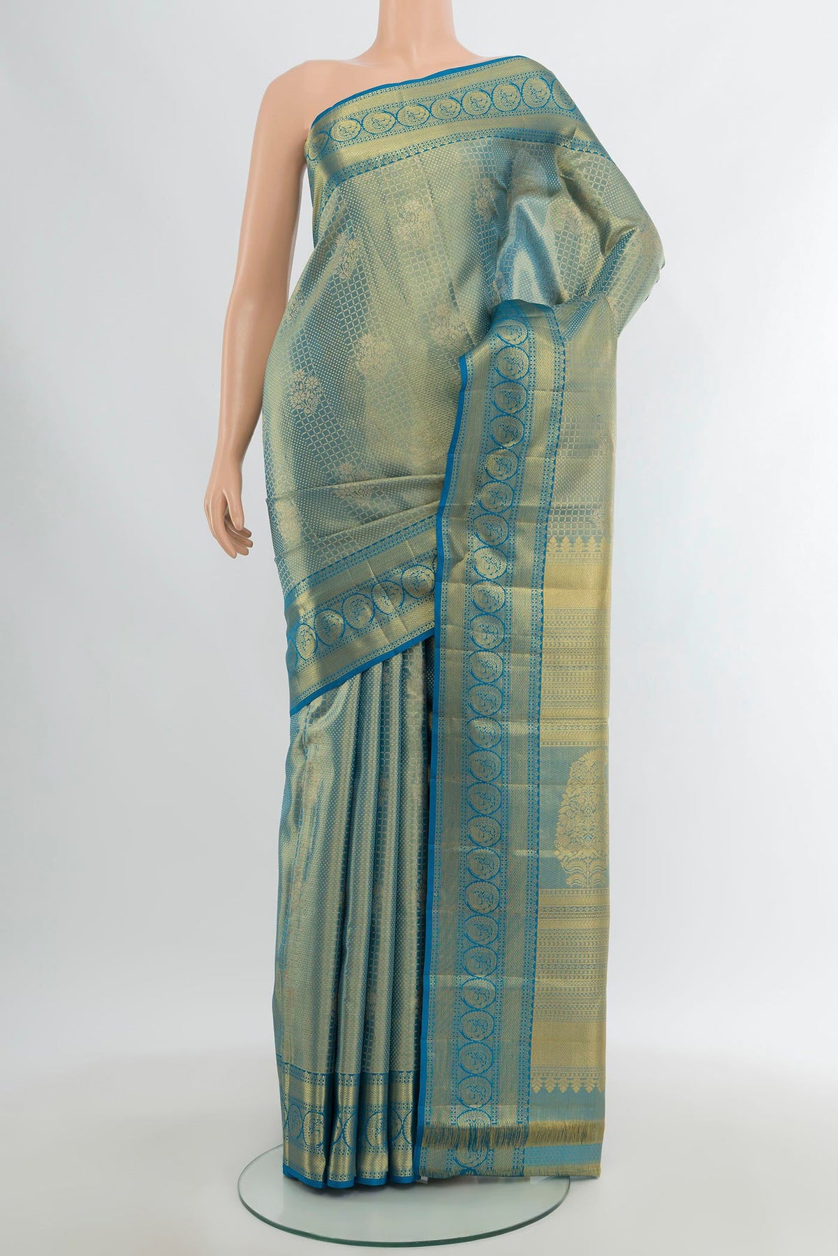 Light Blue Kanchipuram Silk Saree with Zari Brocade on the body and Zari Border.  displayed on a mannequin