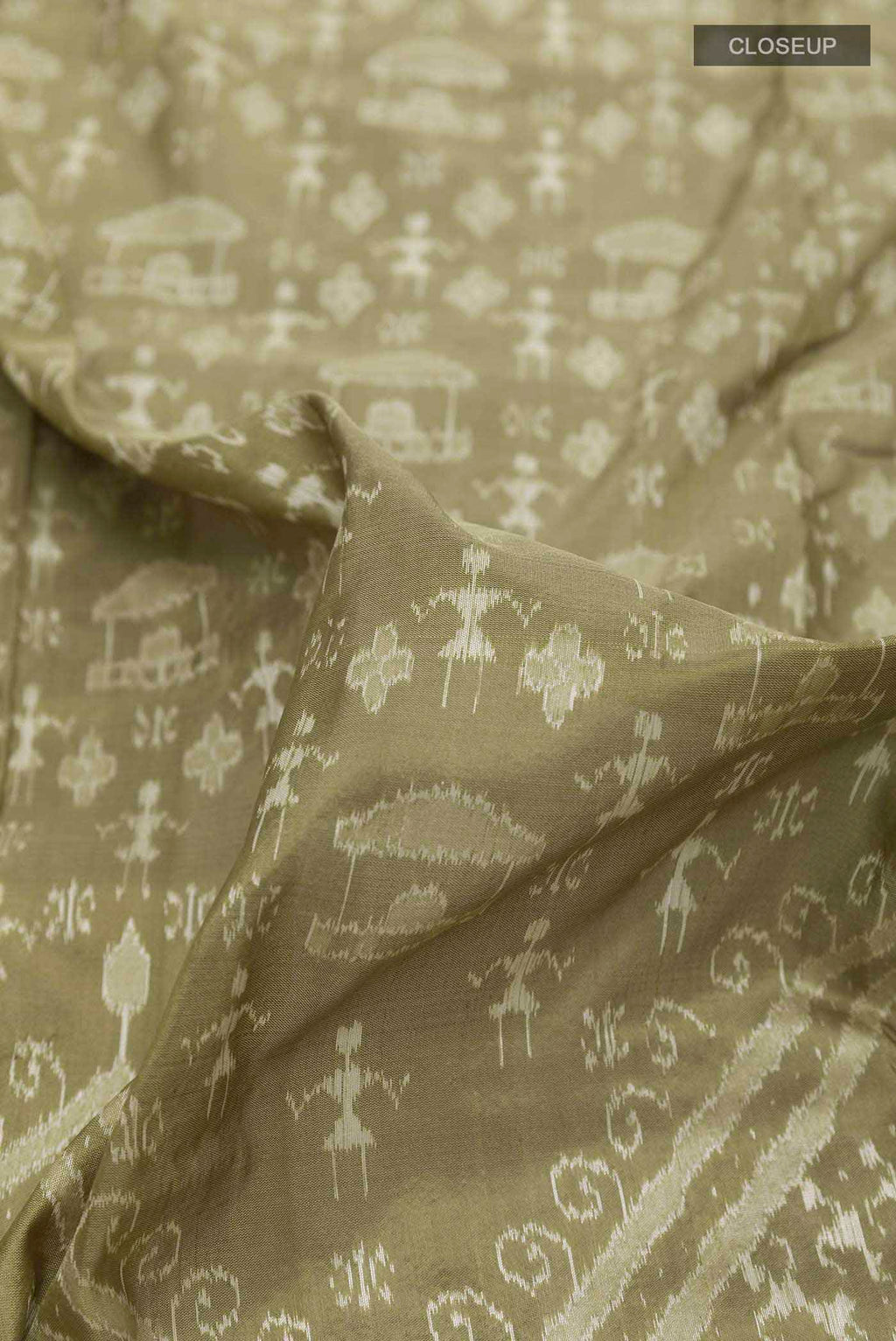 Close up of Olive Green Orissa Silk Saree with Ikat design on the body and Zari Border displaying folds