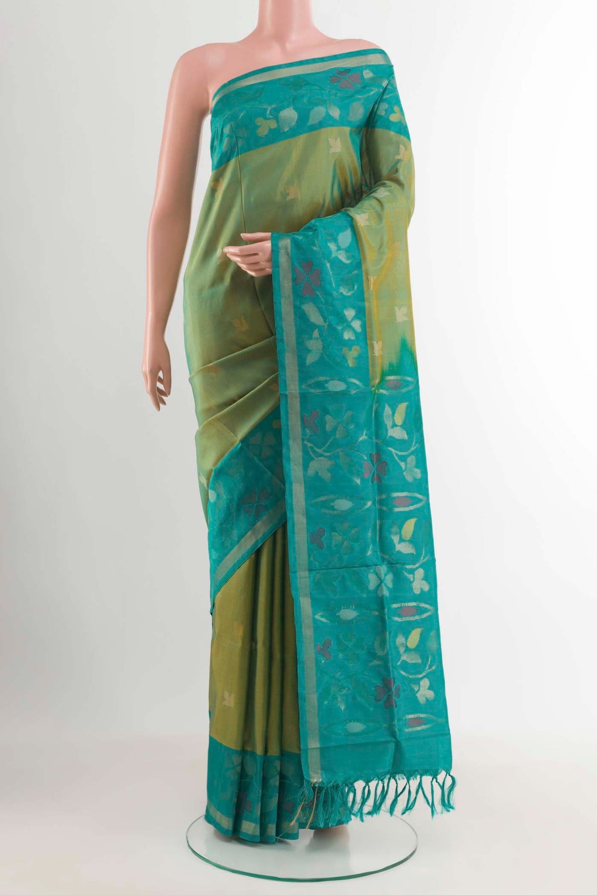 Green Uppada Silk Saree with Zari Butta on the body and Zari Border displayed on a mannequin